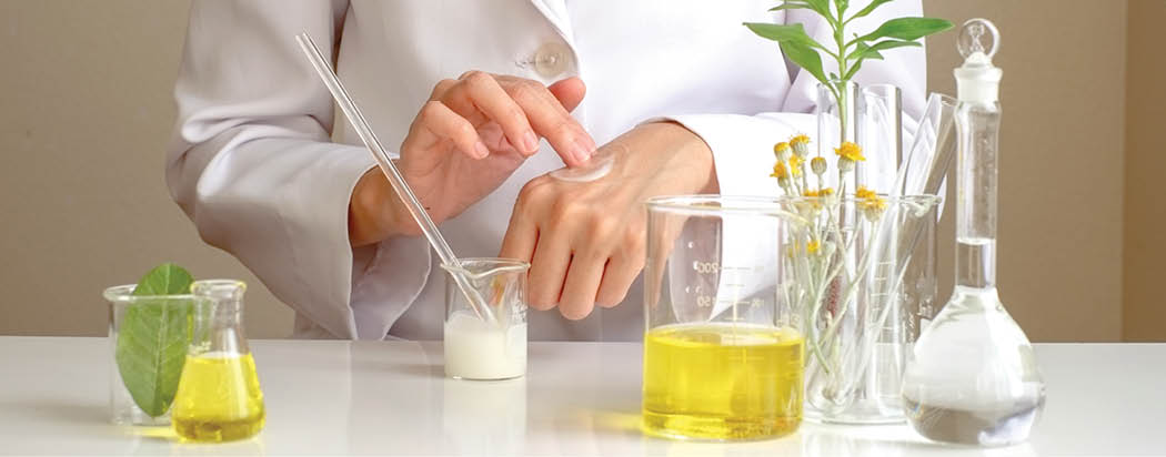 the scientist,dermatologist testing the organic natural cosmetic product in the laboratory research and development beauty skincare concept blank package,bottle,container  cream,serum hand