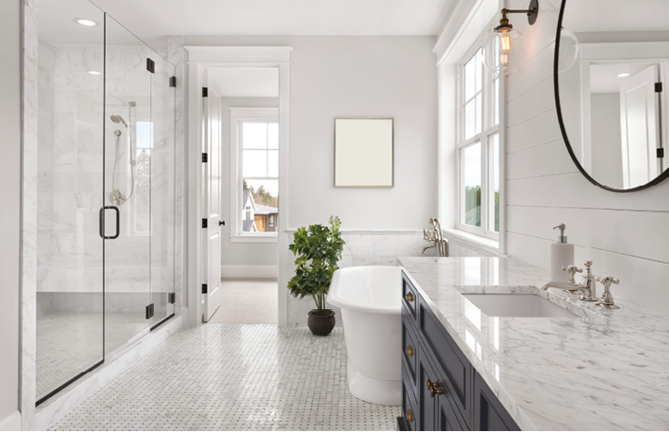 Beautiful Ensuite Master Bathroom in New Luxury Home. Features Elegant Countertop, Bathtub, Shower, and Walk-in Closet