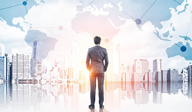 International business concept with businessman on New York city background with network on map and sunlight