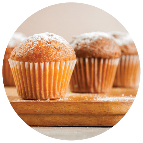 Tasty muffin closeup on a wooden board, selective focus.; Shutterstock ID 1219518373; purchase_order: BENEO; job: Marketing; other: Tools